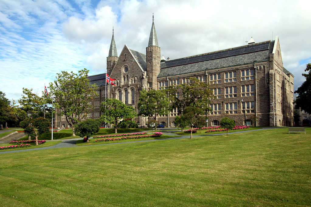 NTNU. <p style="font-size: 0.9rem;font-style: italic;"><a href="http://www.flickr.com/photos/87309452@N03/8008612867">"Hovedbygningen_20juli_2007_017"</a><span>by <a href="http://www.flickr.com/photos/87309452@N03">Trondheim | Gjøvik | Ålesund</a></span> is licensed under <a href="https://creativecommons.org/licenses/by-nc-nd/2.0/?ref=ccsearch&atype=html" style="margin-right: 5px;">CC BY-NC-ND 2.0</a><a href="https://creativecommons.org/licenses/by-nc-nd/2.0/?ref=ccsearch&atype=html" target="_blank" rel="noopener noreferrer" style="display: inline-block;white-space: none;opacity: .7;margin-top: 2px;margin-left: 3px;height: 22px !important;"><img style="height: inherit;margin-right: 3px;display: inline-block;" src="https://search.creativecommons.org/static/img/cc_icon.svg" /><img style="height: inherit;margin-right: 3px;display: inline-block;" src="https://search.creativecommons.org/static/img/cc-by_icon.svg" /><img style="height: inherit;margin-right: 3px;display: inline-block;" src="https://search.creativecommons.org/static/img/cc-nc_icon.svg" /><img style="height: inherit;margin-right: 3px;display: inline-block;" src="https://search.creativecommons.org/static/img/cc-nd_icon.svg" /></a></p>