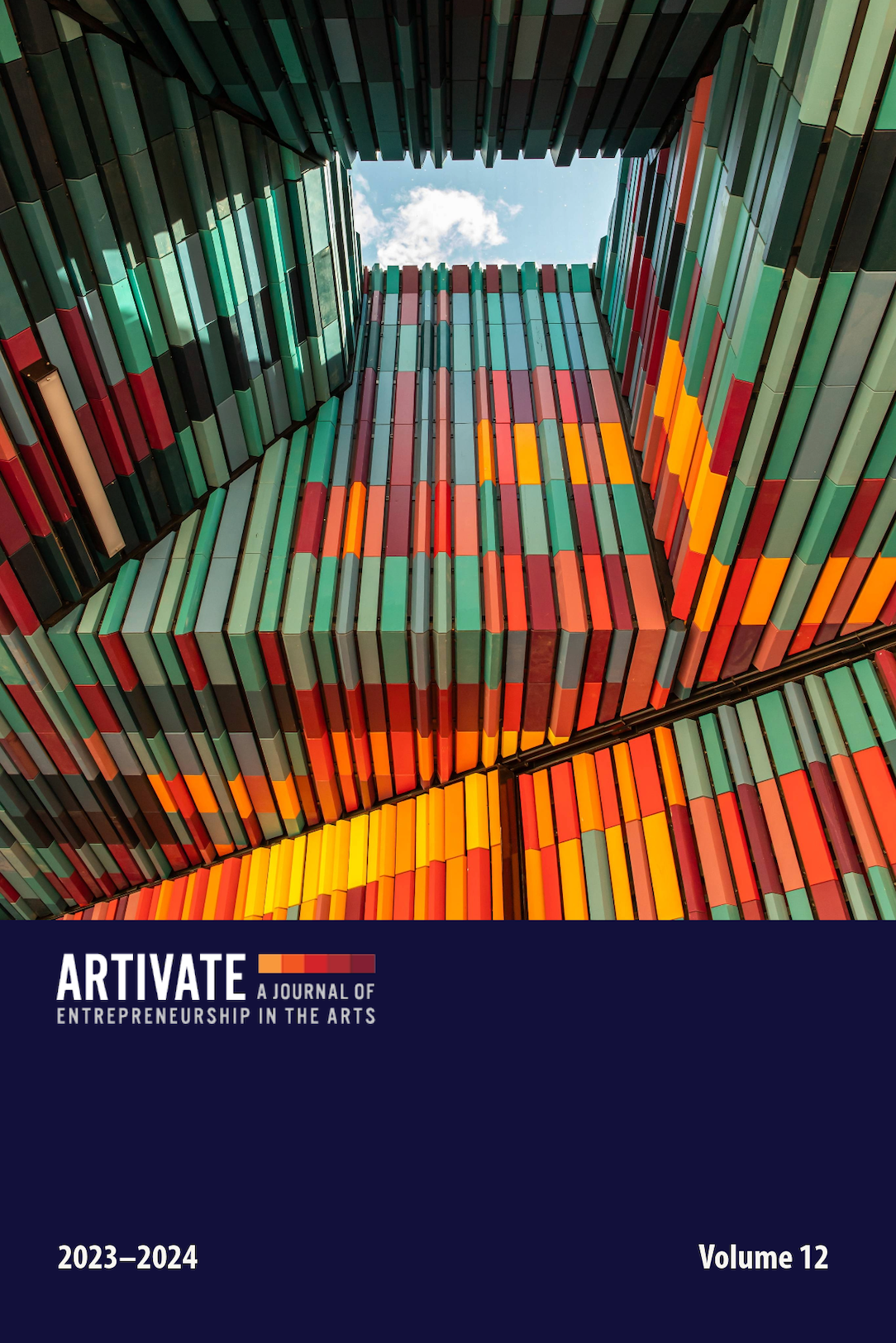 Cover image of Volume 12, featuring a photo of multi-color tiles in a geometric pattern on the roof of a building.